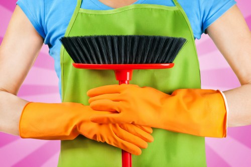 Technician checking cleaning chemicals and safety controls before use