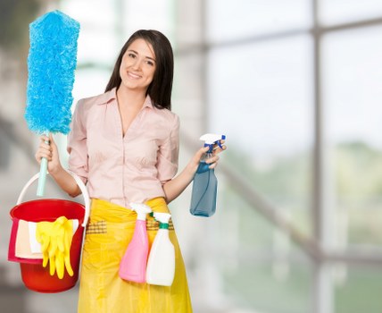 Cleaning technician preparing equipment for a booked job